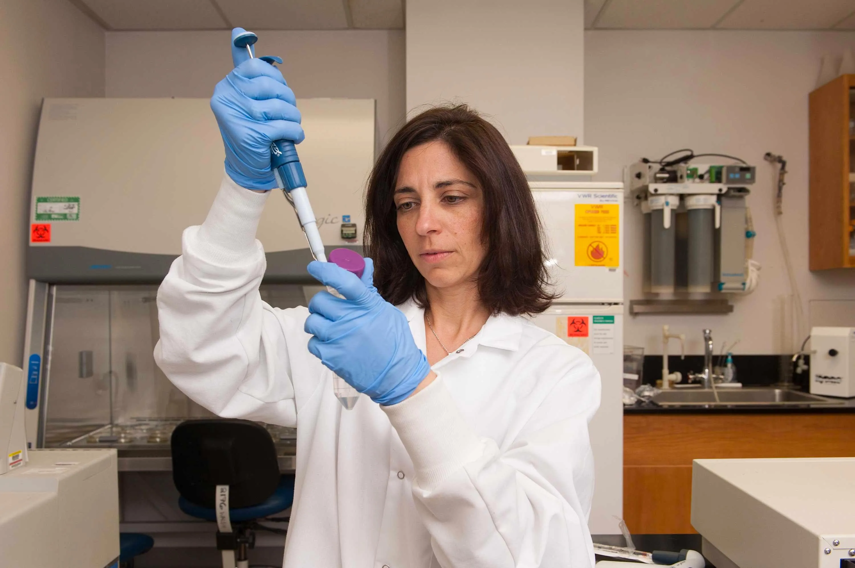 shirley in white lab coat with pipette
